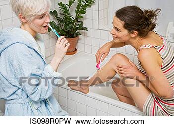 lesbian-couple-bathroom_~IS098R0PW.jpg